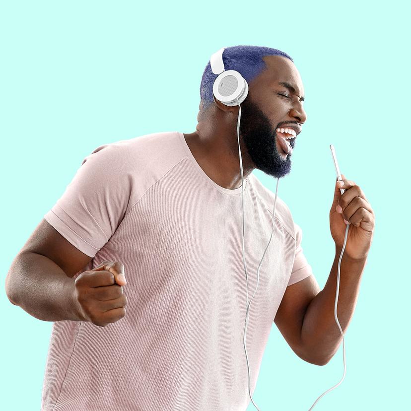 Man singing happily into microphone